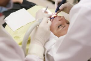 Dental tools on a tray for immediate vs delayed dental implants.