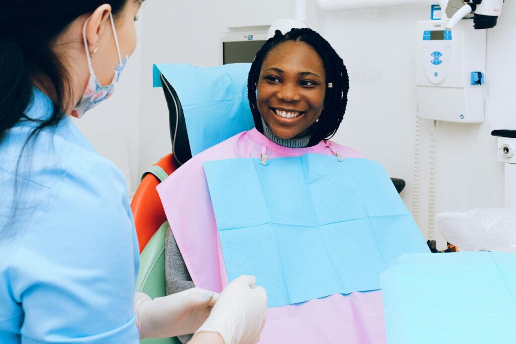 Dentist examining a patient's teeth to determine toothache causes.
