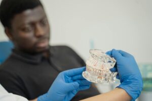 Dentist working on a cracked molar with dental tools.