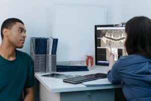 Dentist working on all-on-4 case planning with dental instruments.