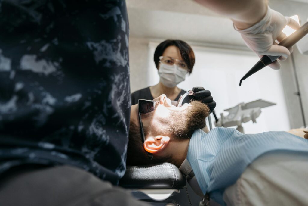 Close-up of a dental model and digital tablet.