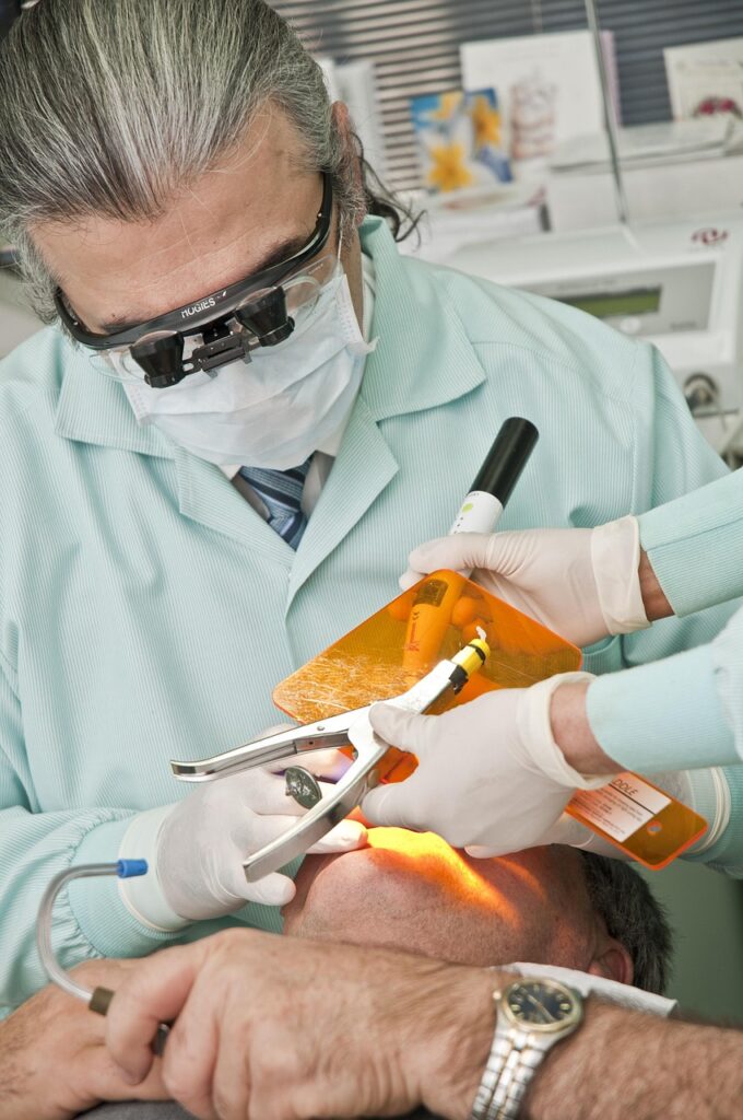 Dentist performing a dental procedure on a patient.