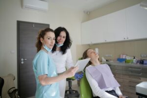 Dentists in a judgment-free dental office with a patient.
